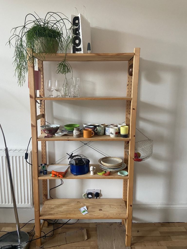 Tall wooden storage shelves 