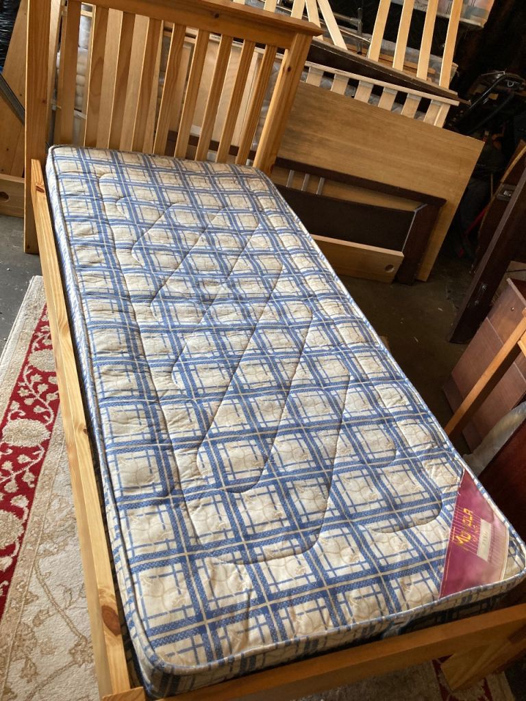 Single wooden bed with mattress 