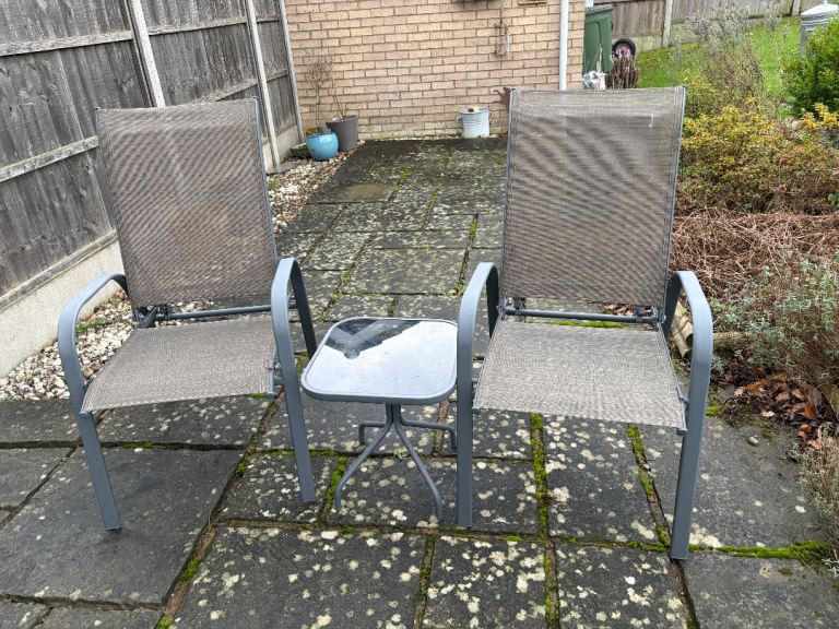 Reclining garden chairs with small table