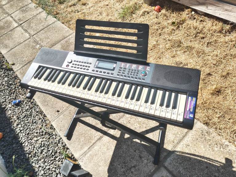 Electronic Keyboard with Stand – Good Condition