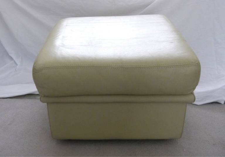 Soft, leather footstool.
