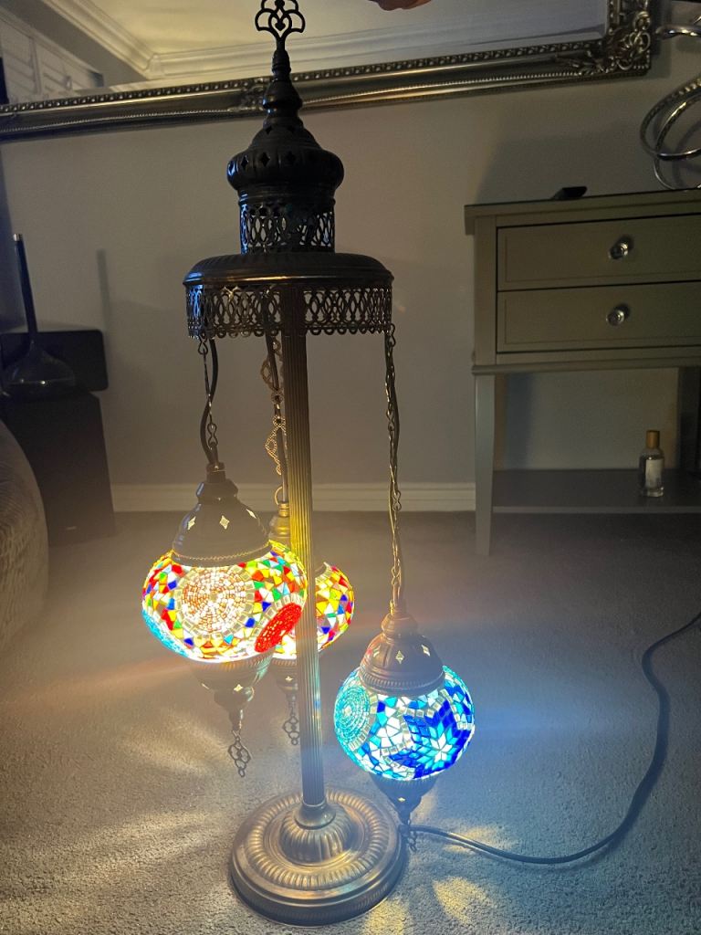 Moroccan style Tiffany effect glass mosaic floor lamp with a brass metal finish