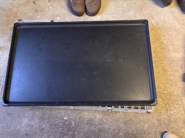 Large dog crate with black plastic insert 