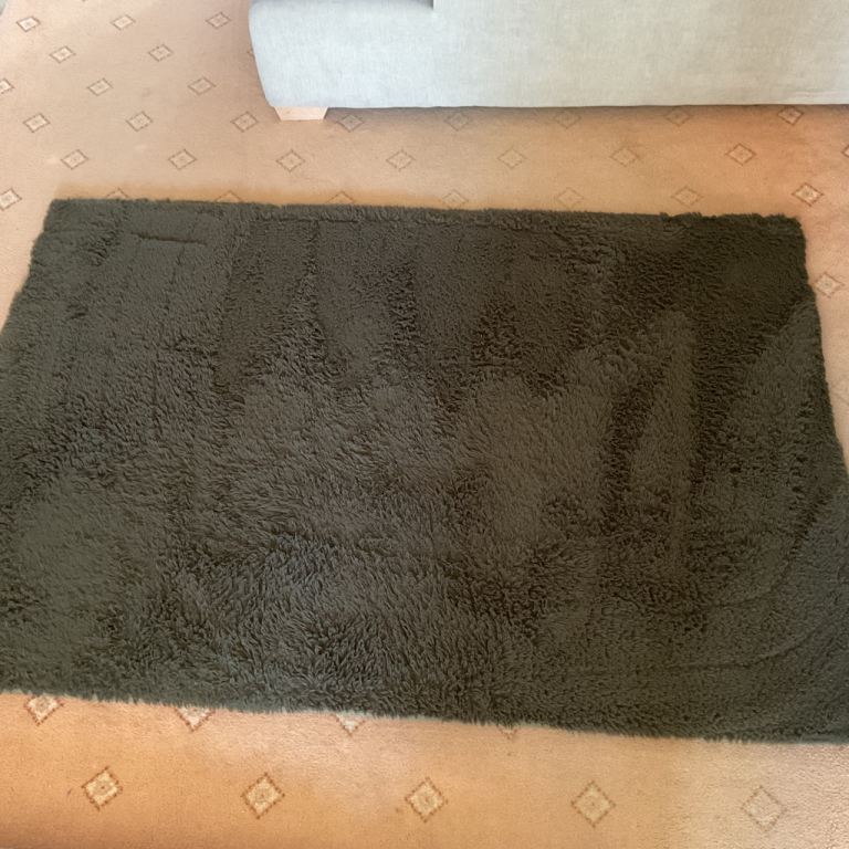 Chocolate brown fur rug approx 5ft x 3 and a half ft