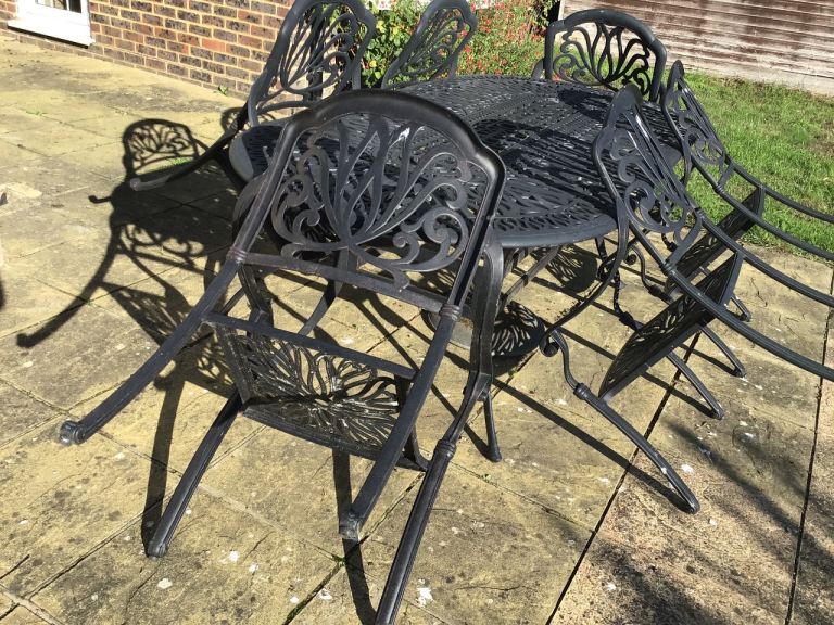 Cast iron garden table and chairs