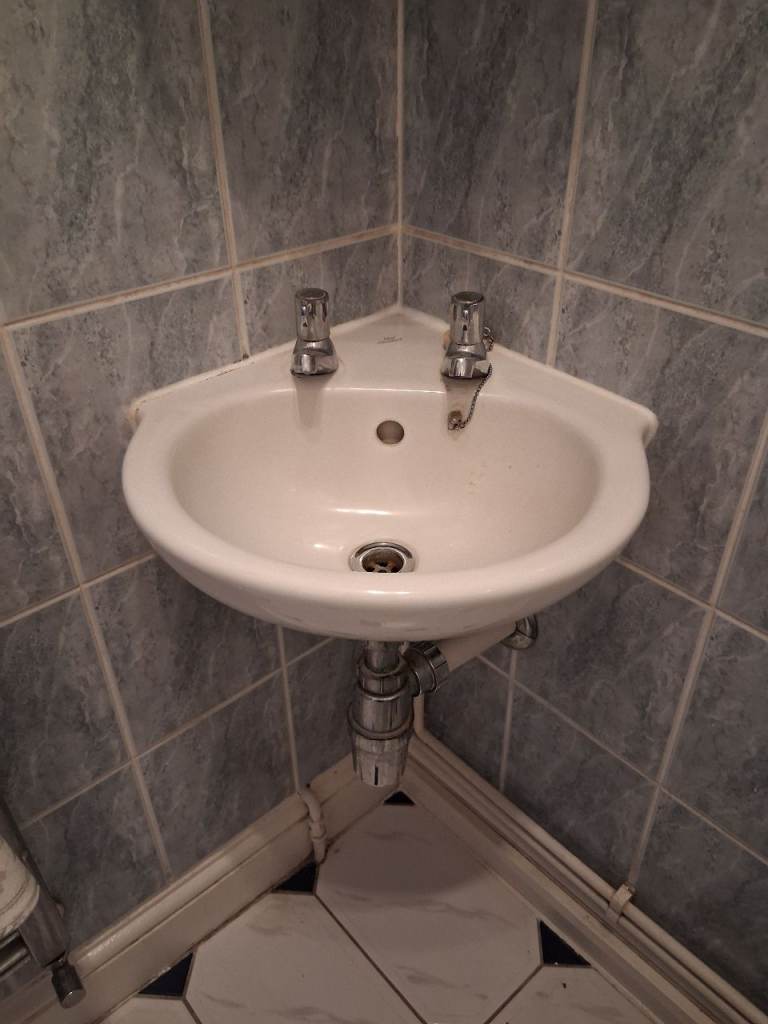 WHITE CHINA CORNER BASIN WITH CHROME LEVER TAPS, AND WASTE FITTING