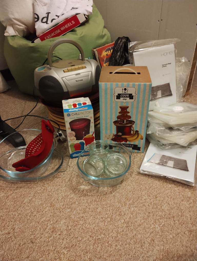 waffle maker,oven dishes,cake tin,ramekins, choc fountain, slushy,vac storage,radio,airers