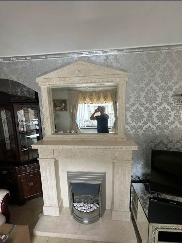 Really nice marble fireplace with electric fire insect with matching mirror £175