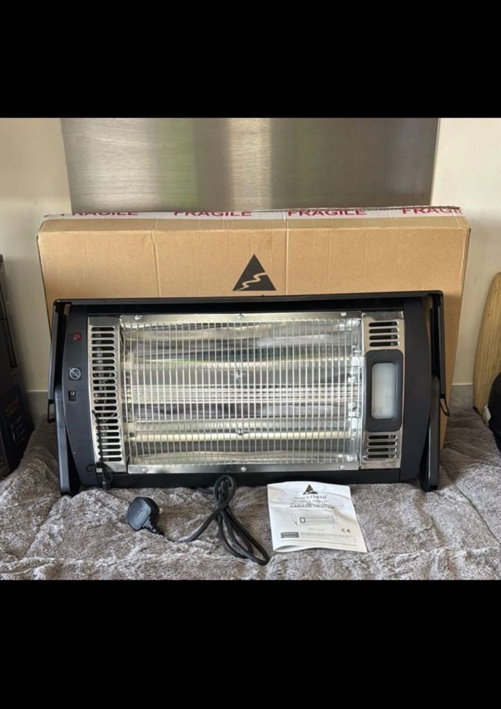 Brand new sortfield electric heater with LED light 