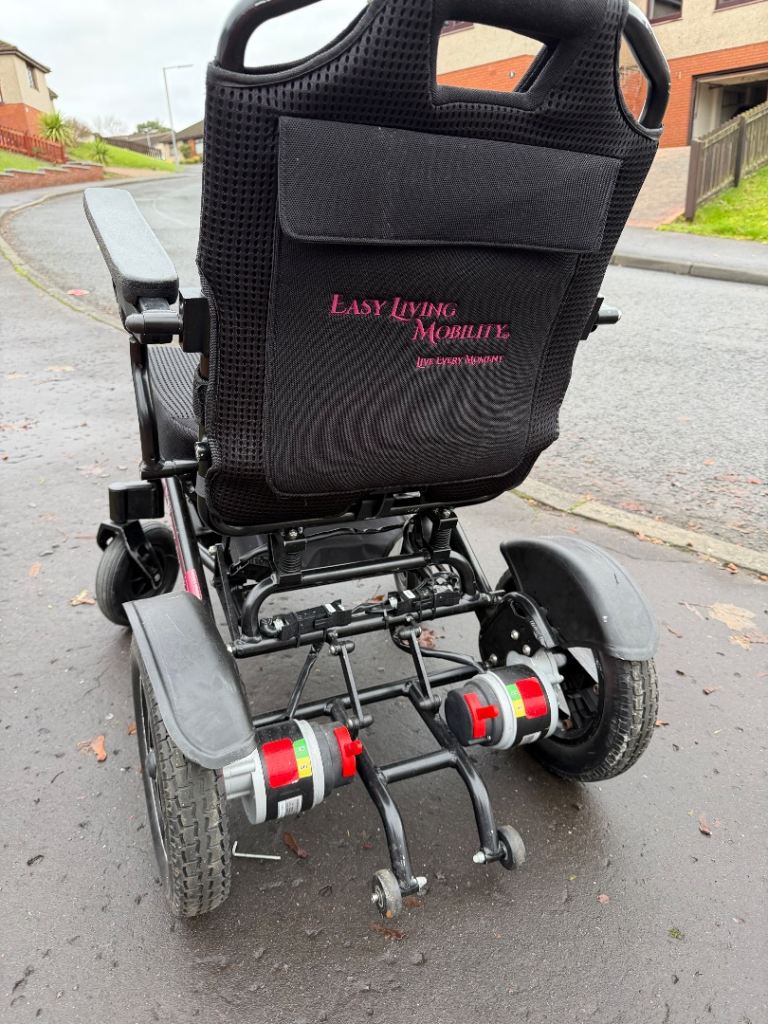 Electric wheelchair with charger and spare battery 