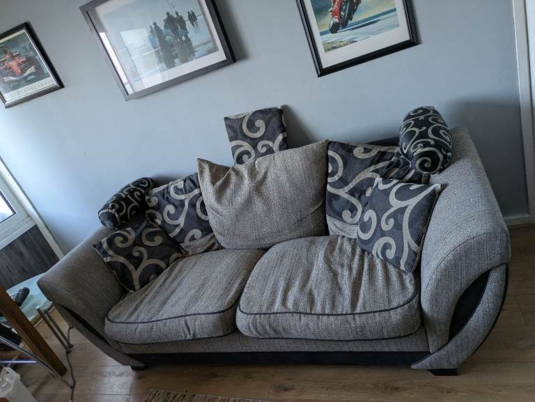 Three seater sofa with cushions and footstool 