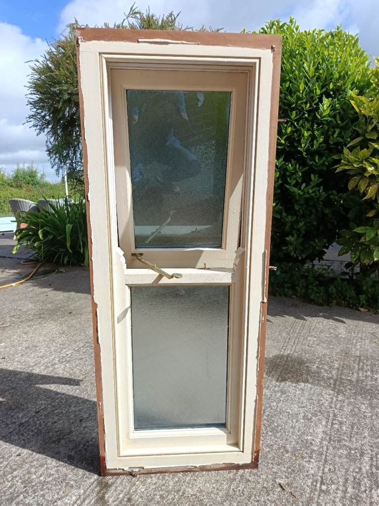 Solid hardwood window frame with opaque glass 