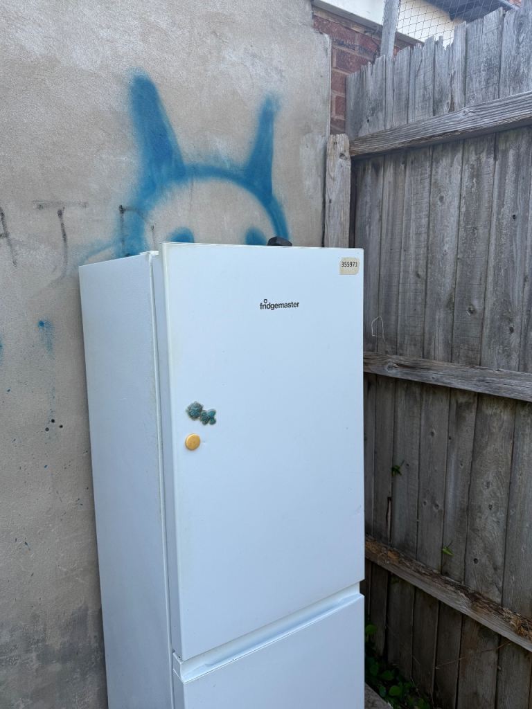 Fridge for sale mint condition but minor dent on the front door