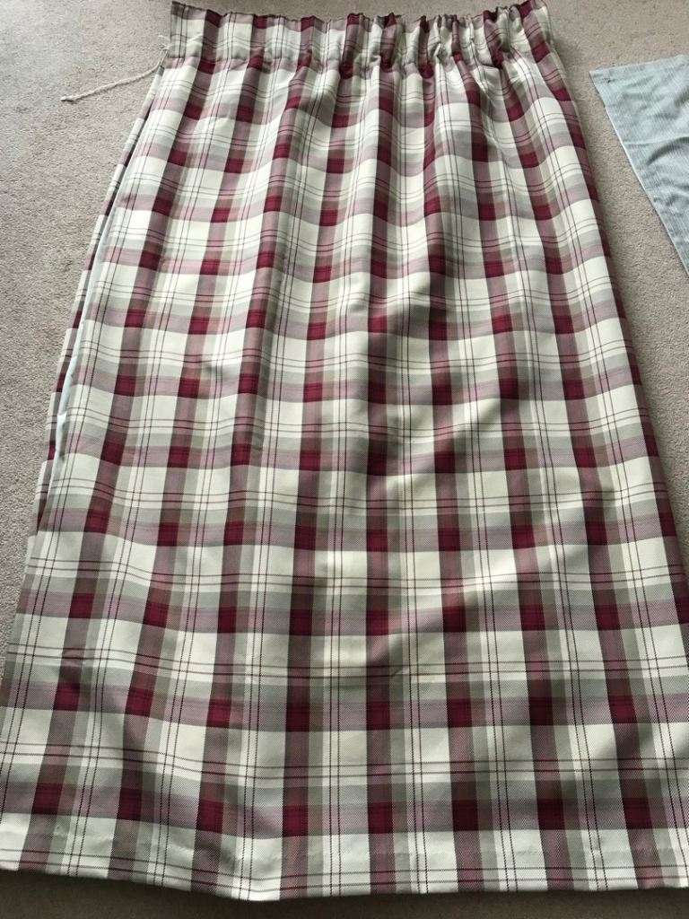 Check pattern pencil pleat curtains.