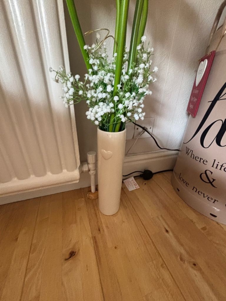 Cream vase with lillies