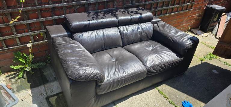 Used leather sofa with adjustable headrest