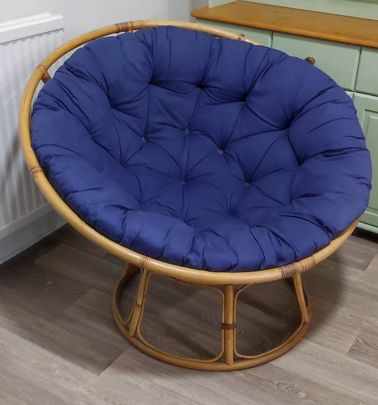 Vintage Papasan chair with blue cushion