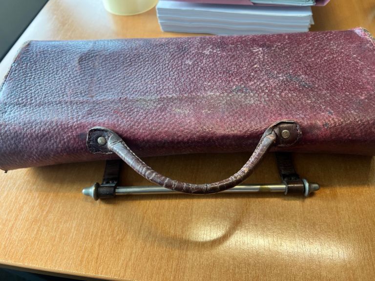 Vintage music bag and piano music sheets