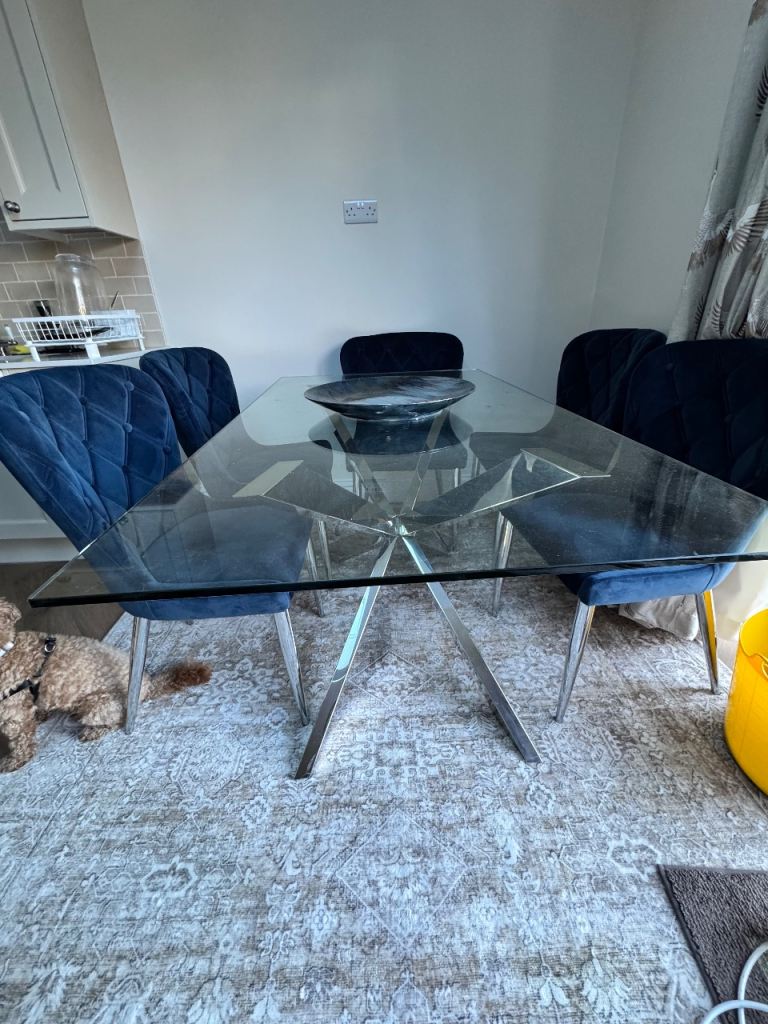 Clear Glass Dining Table with starburst metal legs