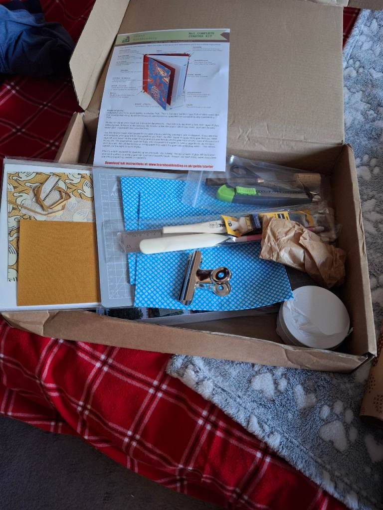 image for Lots of craft papers, accessories for book binding and an unused kit.