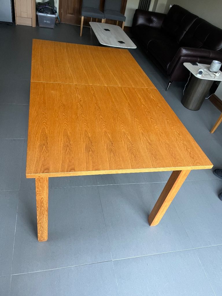 Extending Wooden Dining Table with 6 Grey Fabric Chairs