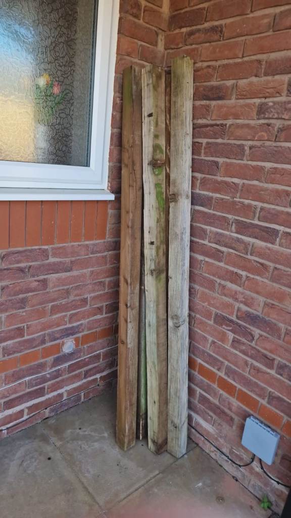 Five six foot by 3 inches fence posts