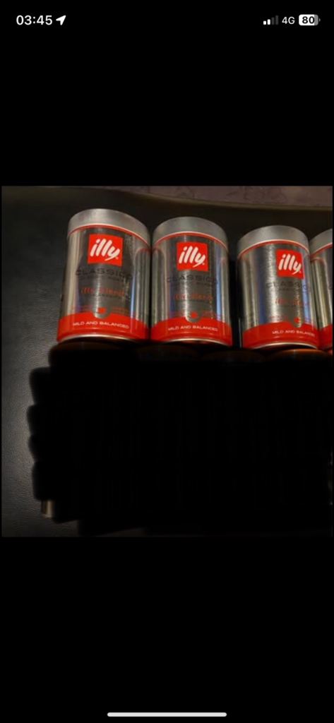 Tins of ground coffee illy Classico 