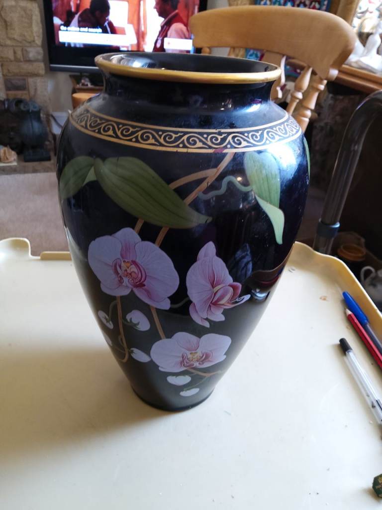 Vase of fragrant orchid