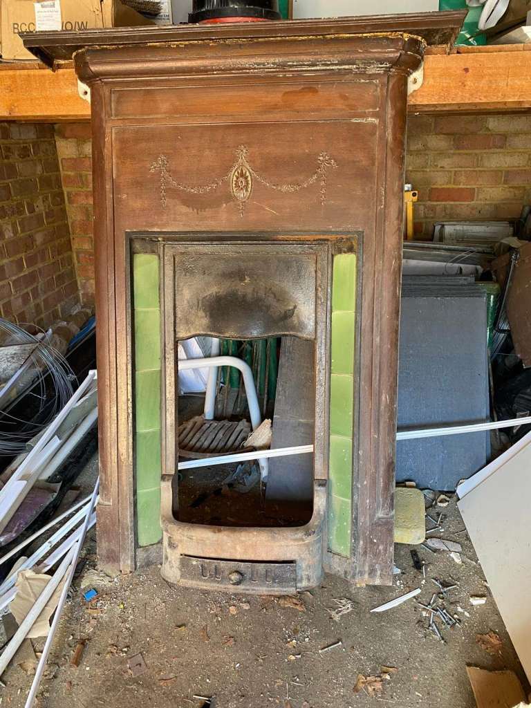 Cast iron fireplace with green tiles