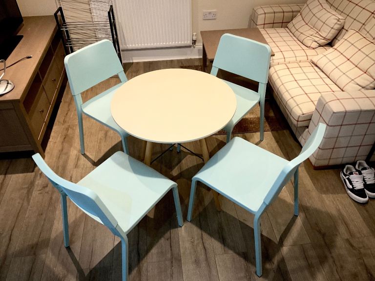 Round Table and 4 Light Blue Chairs 