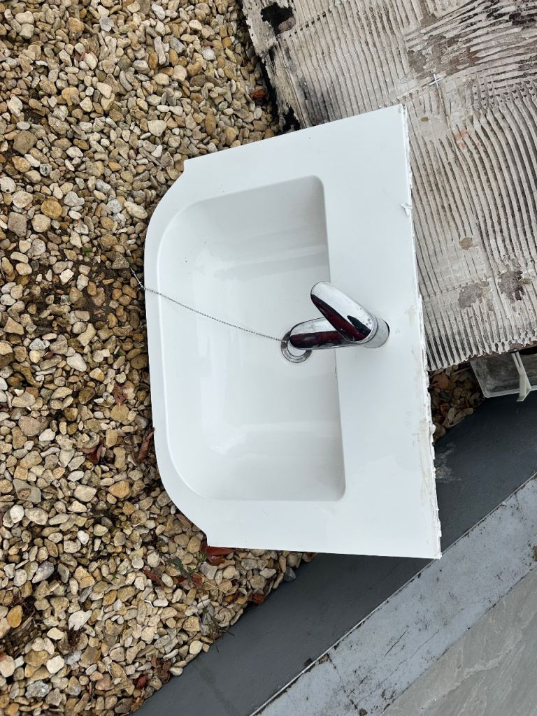 Basin with tap, waste and vanity unit 