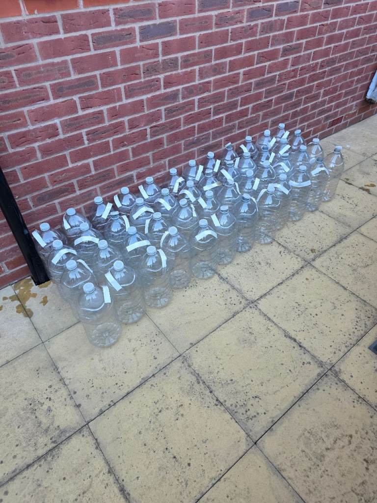 Clear Plastic Bottles with Handles – Good Condition