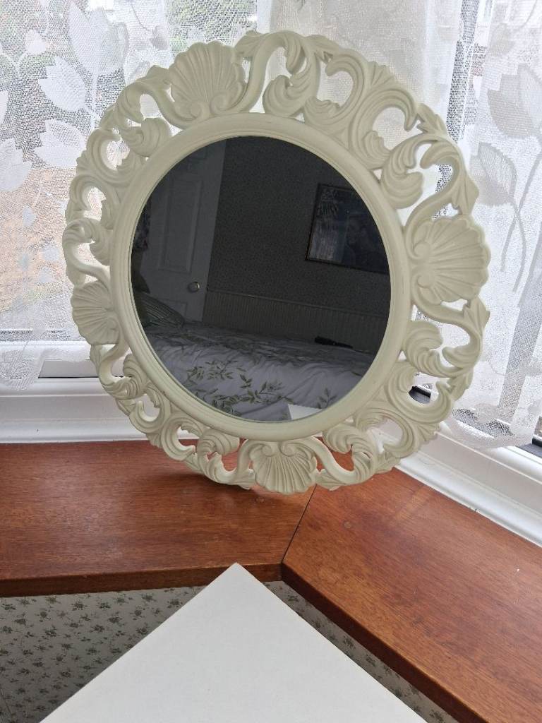 Large round ornate round .irror
