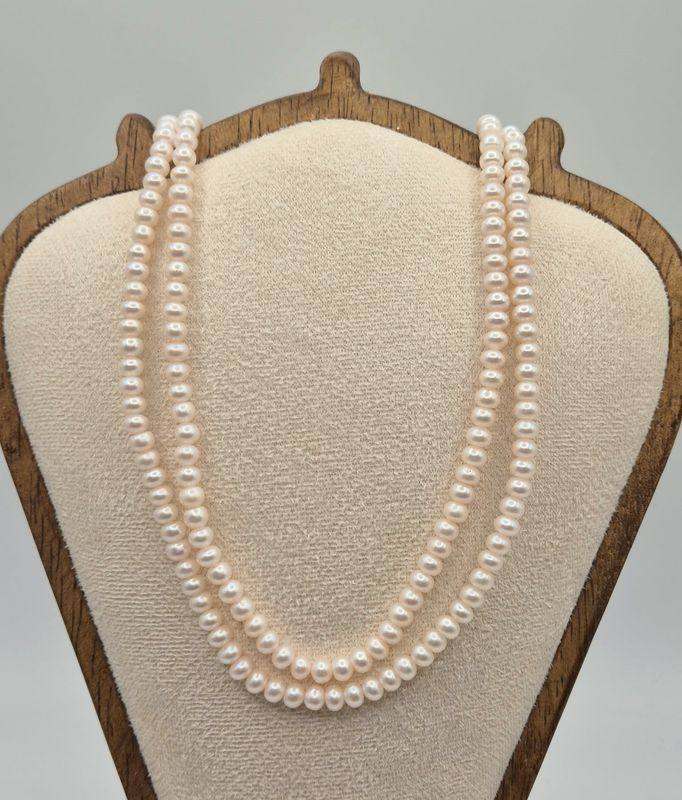 22 inch long double row pearl necklace with gold tone fastening