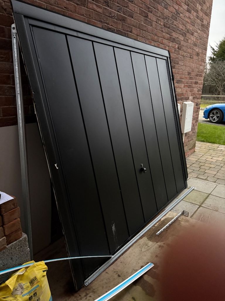 Garage Up and Over Door  Steel Panel Windsor made by Garador less than 3 years old Black in colour 