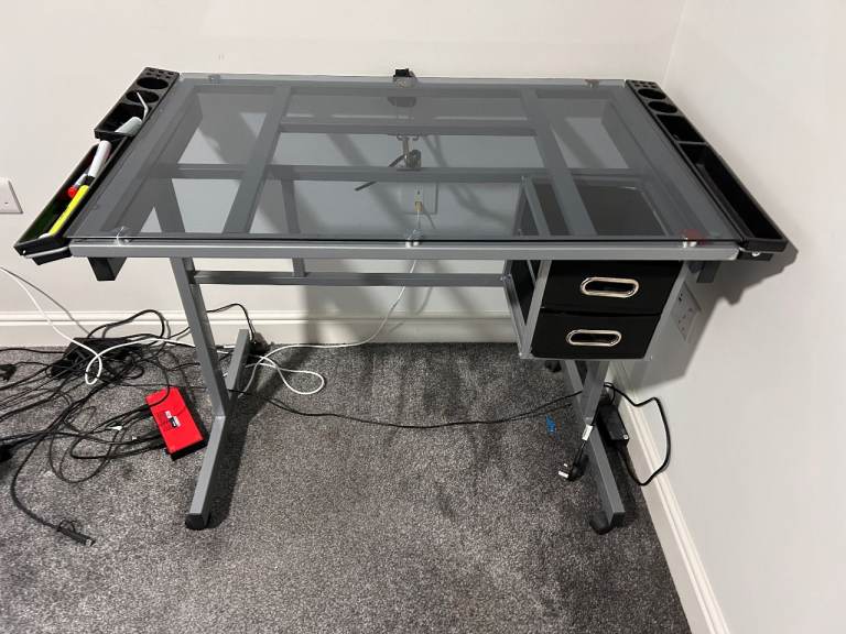 Adjustable Glass desk with a tilting top 