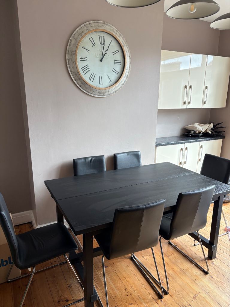 Black extendable dining table and chairs 