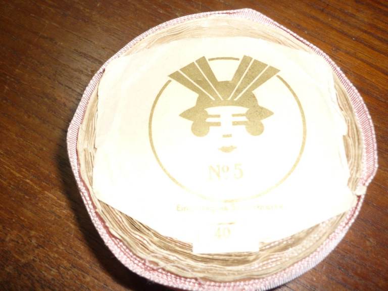Beautiful shade of rose pink ribbon. Judging by the illustration this date from the 1920's
