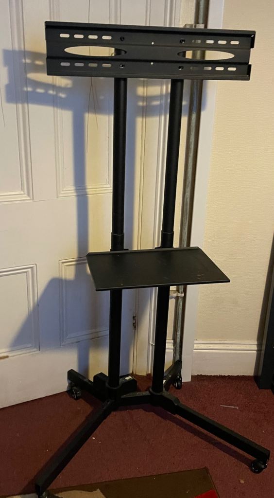  Very big portable Tv stand on wheels around 5.5 foot tall