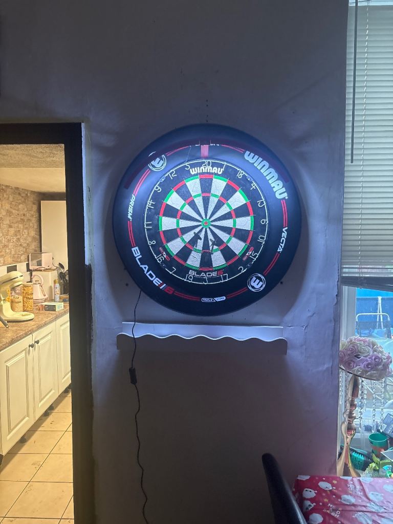 Darts board surround and Luke littler darts and a oche with bar 