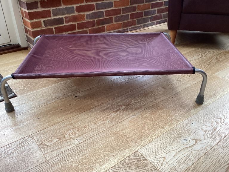 Large elevated dog bed with attachable washable bedding 