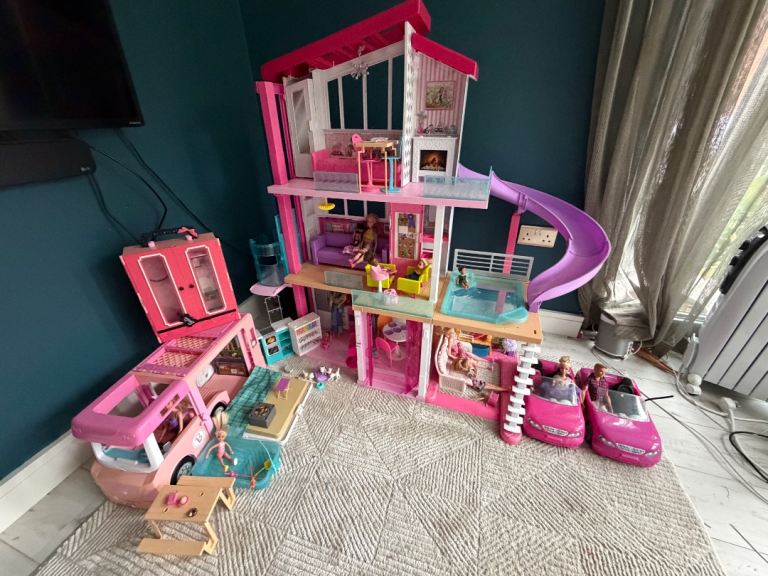 Barbie dream house with dolls, cars and camper van