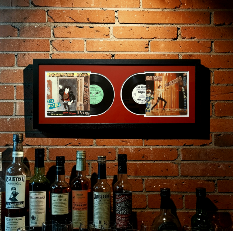 Original framed Sex Pistols vinyl 7in records / picture