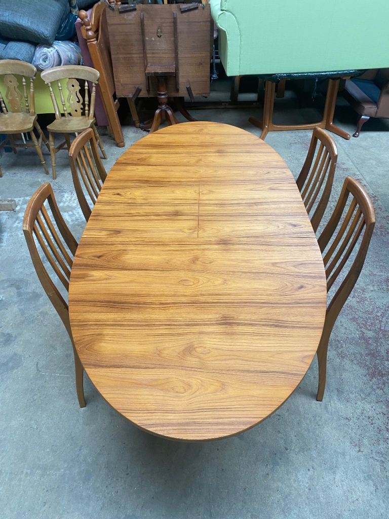 image for A MID-CENTURY TEAK EXTENDING 6/8 SEATER DINING TABLE & 4 CHAIRS BY S-Form FURNITURE
