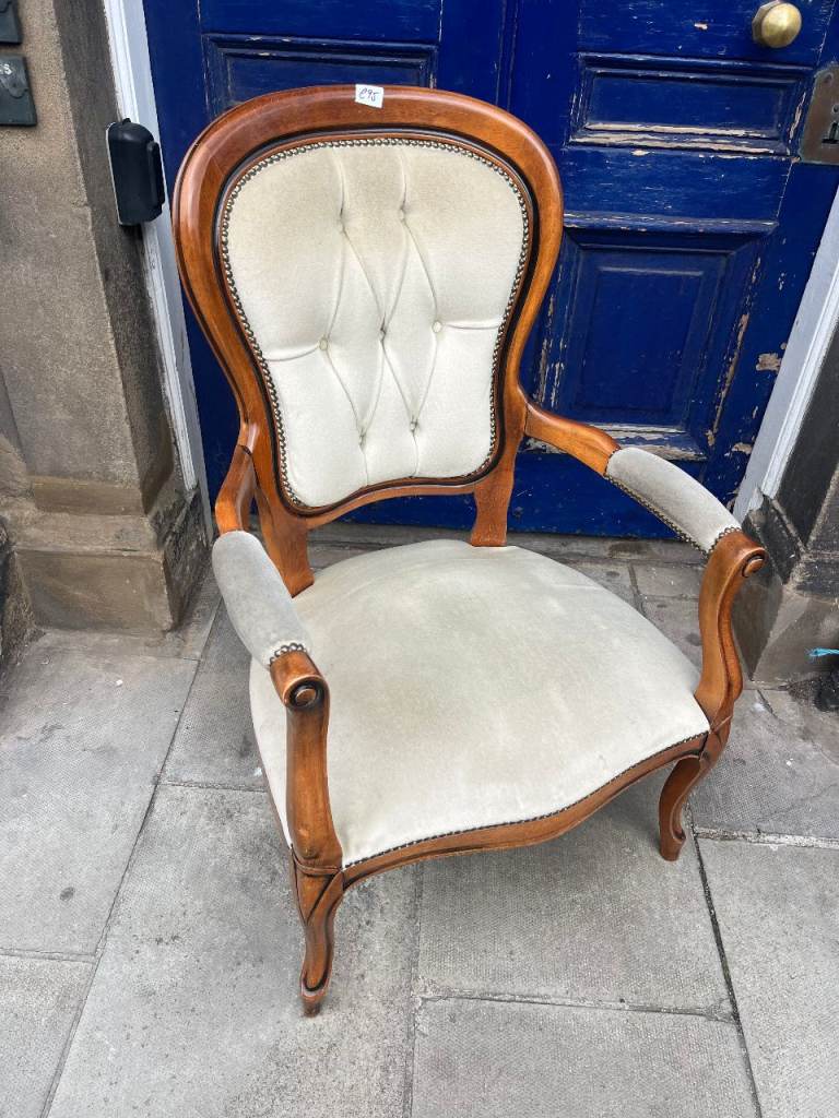 Large Open Armchair , with button back .   
