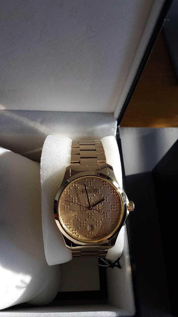 Unisex gold plated Gucci watch 