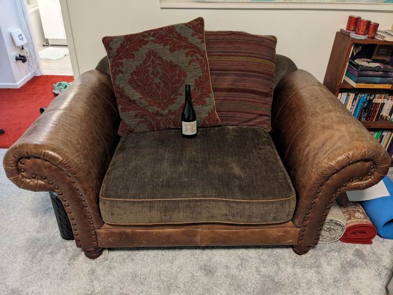 Very large brown leather armchair 