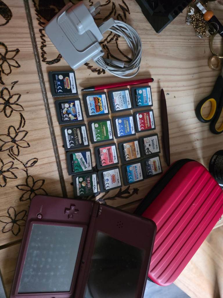 Nintendo DS XLi Console with Games and Charger – Good Condition