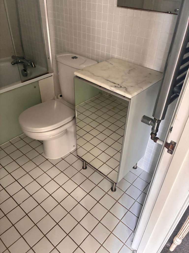 Compact White Bathroom Cabinet with Marble Top and Mirrored Front