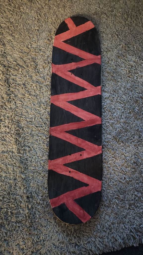 Used Skateboard Deck – Black and Red Zigzag Design